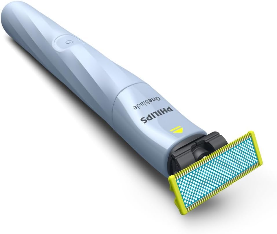 Philips OneBlade First Shave wet-dry use image shows versatile shaving in shower or at sink.