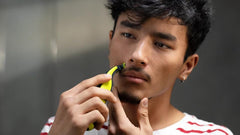 Philips OneBlade skin-guard protection for safer sensitive-area trimming.