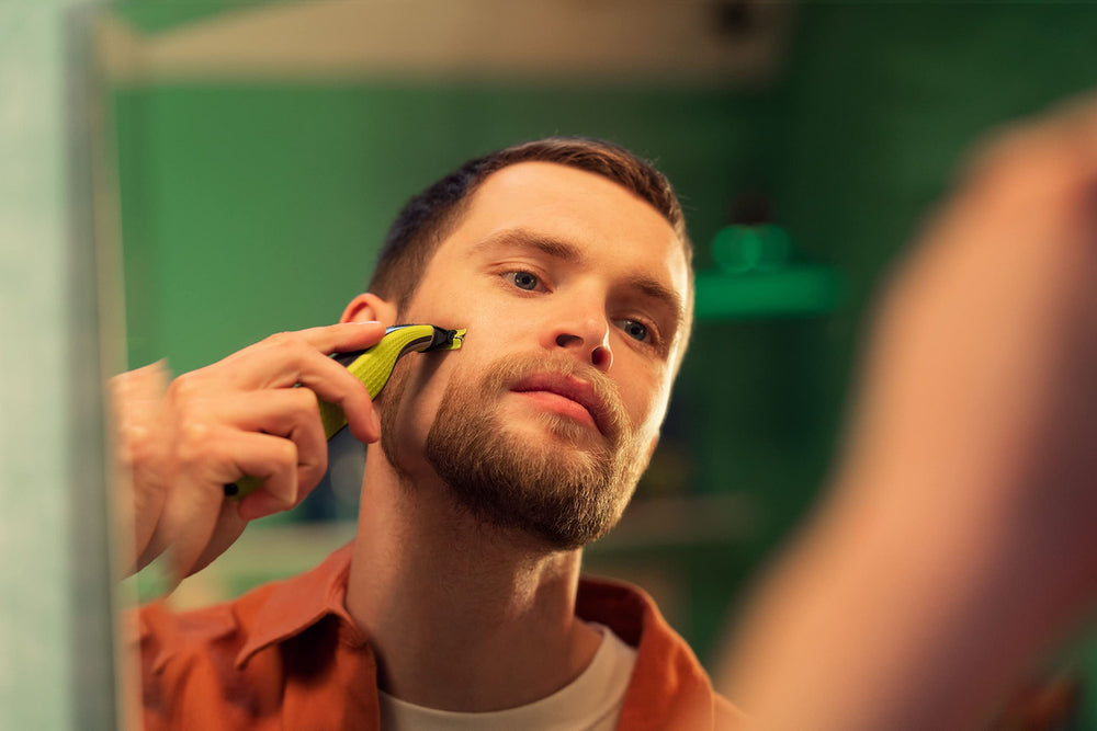 Philips OneBlade stainless-steel blades close-up—sharp edge for comfortable shaves.