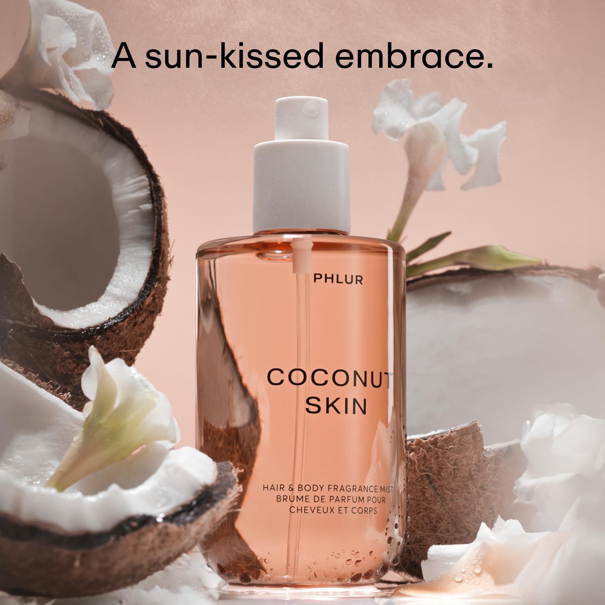 PHLUR Coconut Skin mist dispense captured for quick refresh and layering.