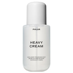 PHLUR Heavy Cream bottle close-up highlighting a creamy fragrance blend for all-day wear