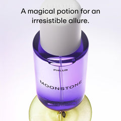 PHLUR Moonstone bottle-spray-application demonstrates easy, lightweight mist for quick refresh.