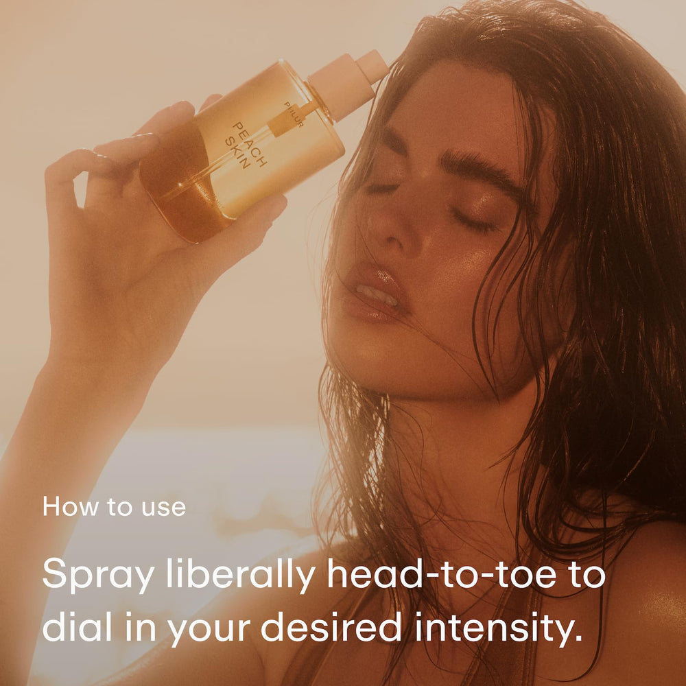 PHLUR Peach Skin Body Mist bottle closeup shows creamy core and elegant label.