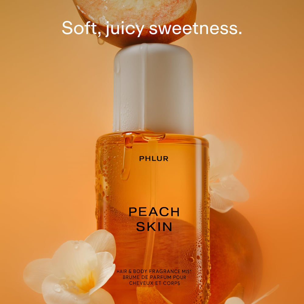 PHLUR Peach Skin Body Mist spray action captures refreshing mist for hair and skin.