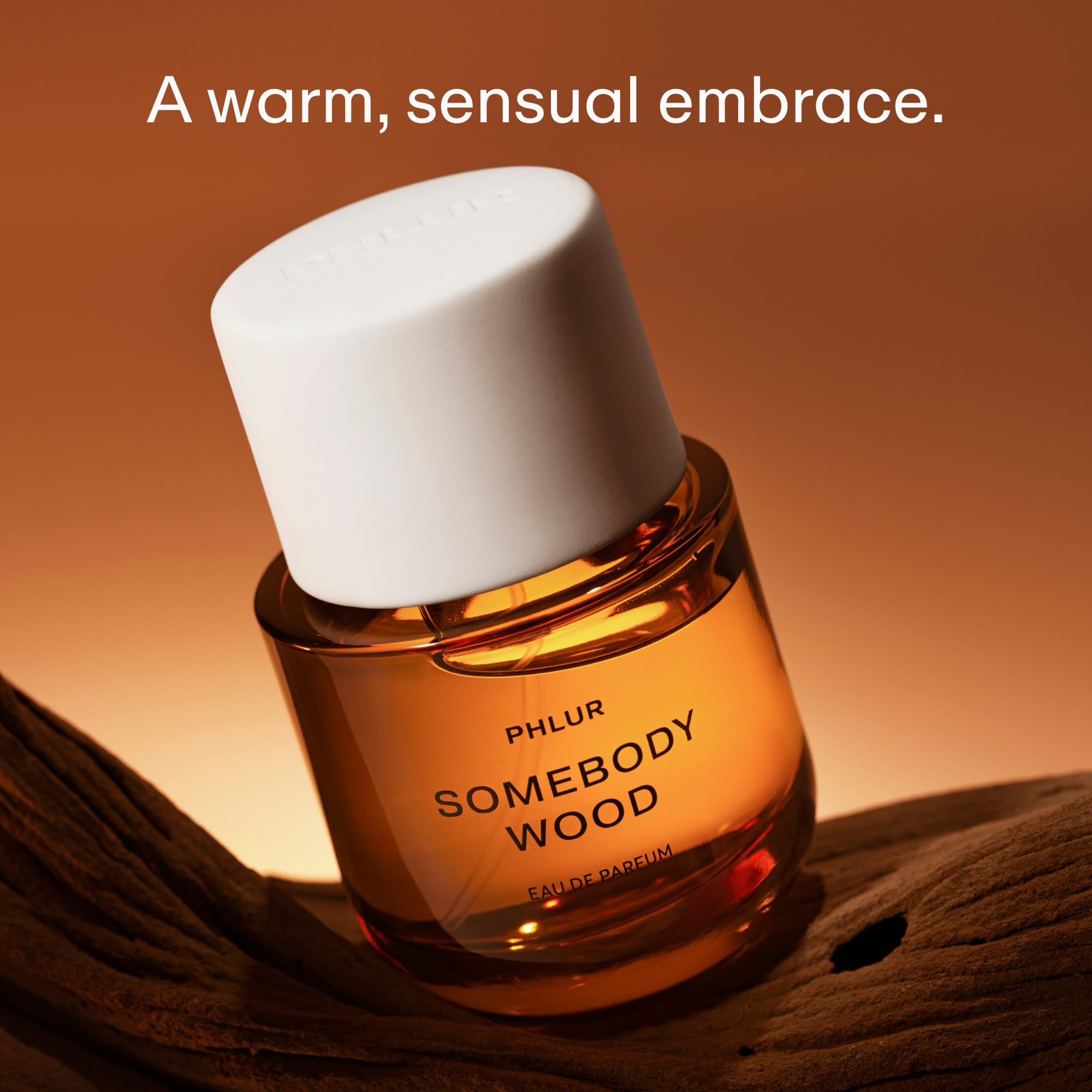 PHLUR Somebody Wood note-visual shows cedarwood and sandalwood notes for a warm, earthy impression.