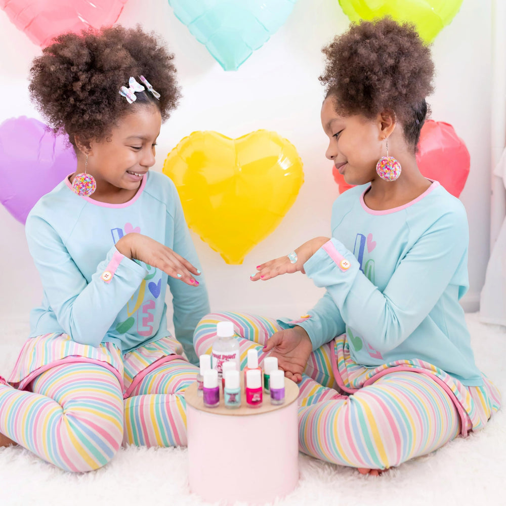 Piggy Paint quick-dry tip uses a warm hair-dryer for faster setting.