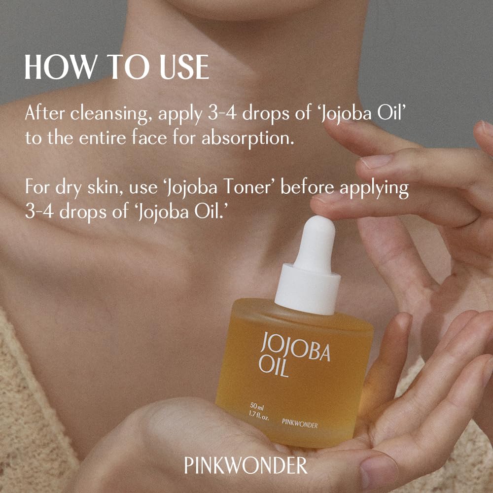 PINKWONDER Jojoba Oil applied to cuticles for nail care.