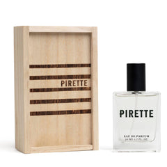 Pirette Eau de Parfum bottle close-up highlighting beachy coconut notes for daily wear