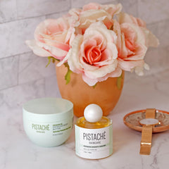 Pistaché Skincare perfume bottle on vanity shelf for all-day wear and appeal.