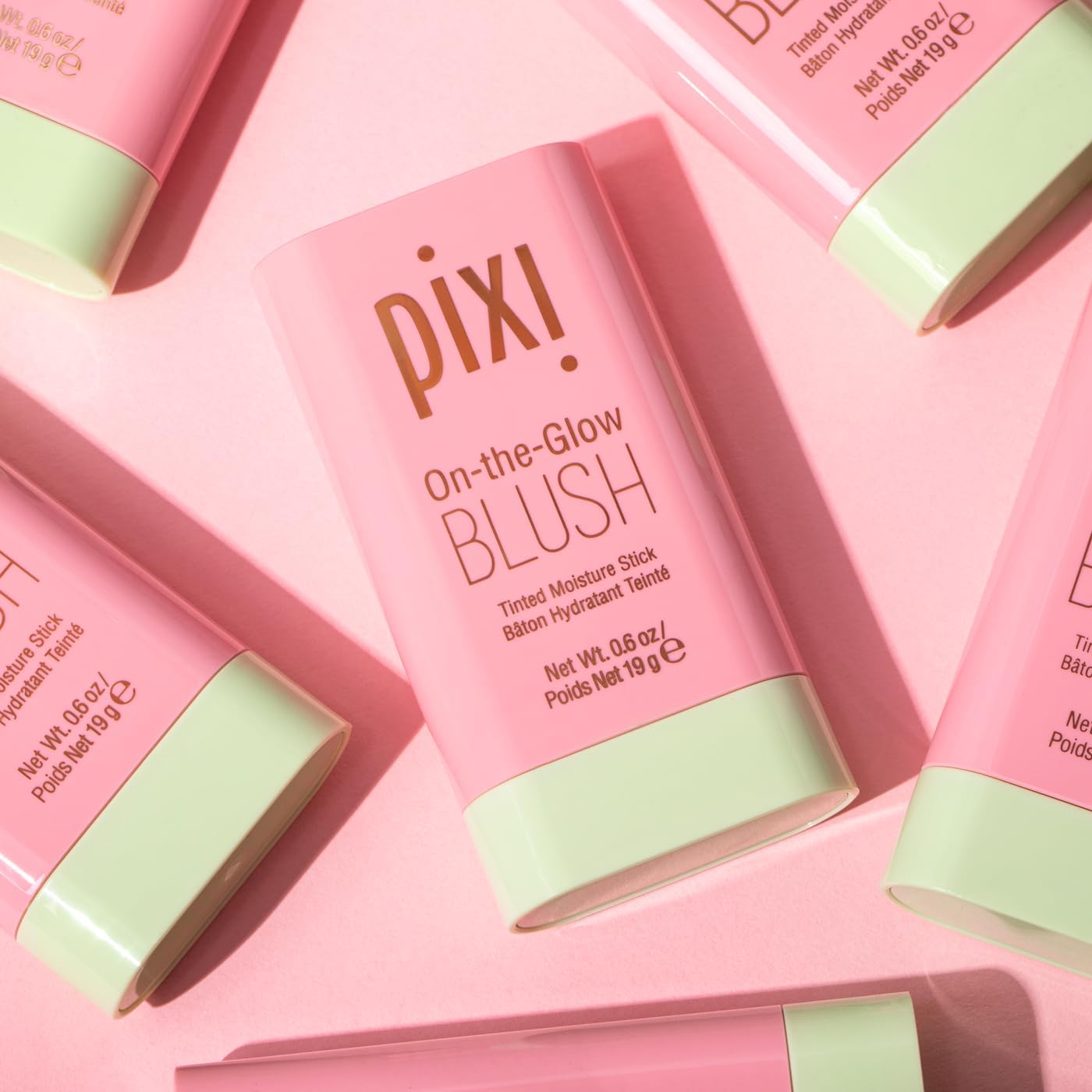 Pixi On-the-Glow Blush Fleur hand swirl displays even color payoff