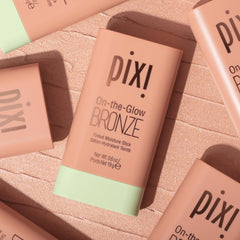Pixi On-the-Glow Bronze SoftGlow stick blended on skin for seamless color payoff