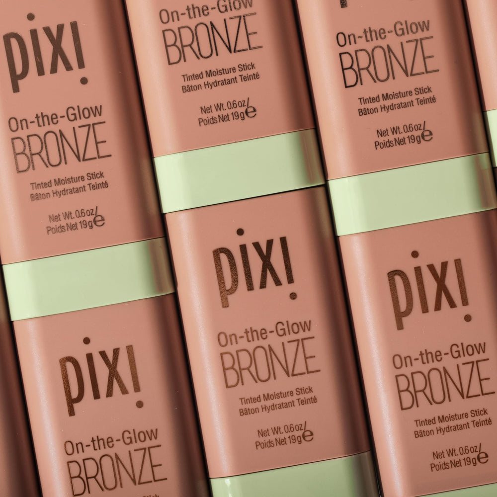 Pixi On-the-Glow Bronze stick on lips for hydrating, tinted color.