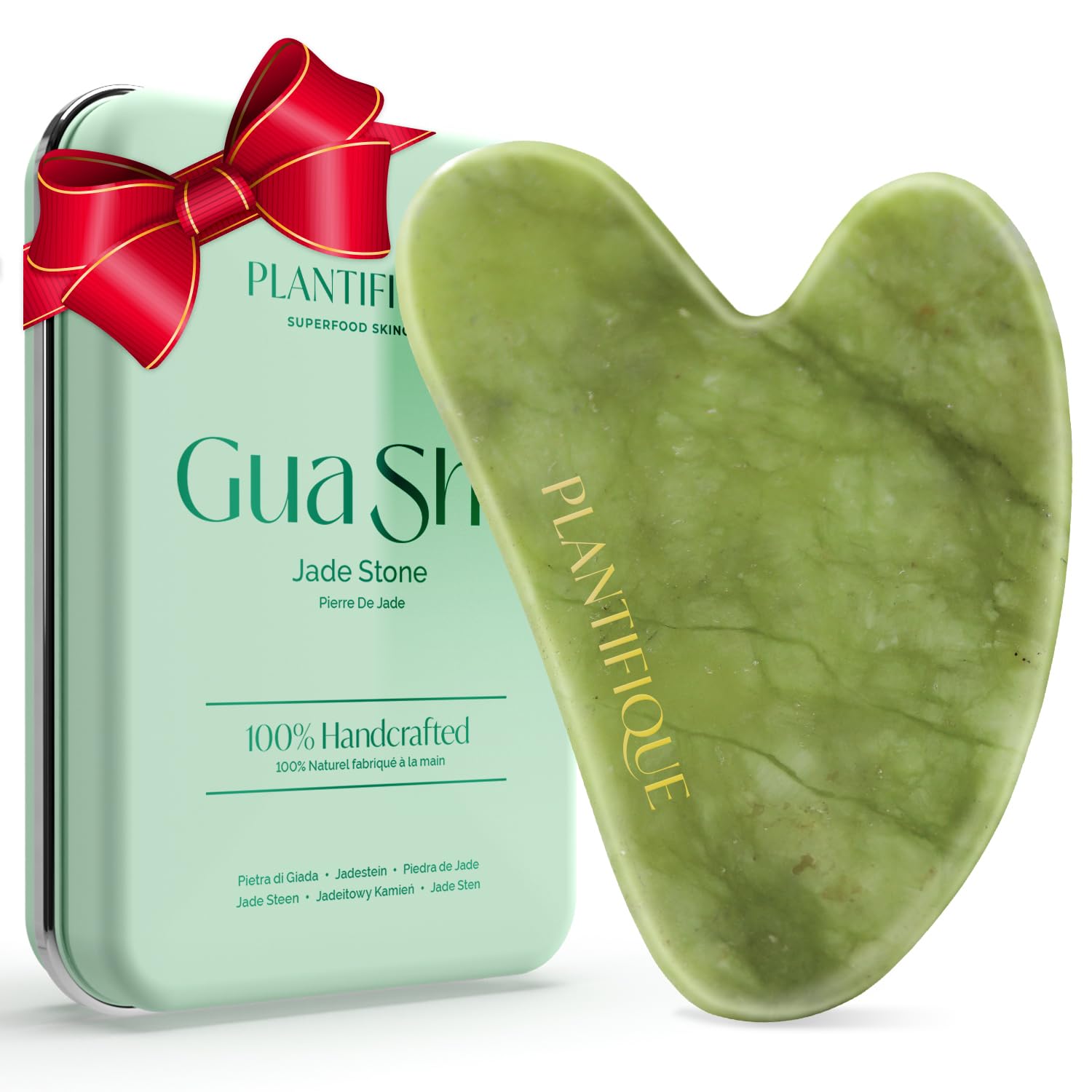 PLANTIFIQUE Gua Sha face tool closeup with smooth jade surface for gentle skincare massage.