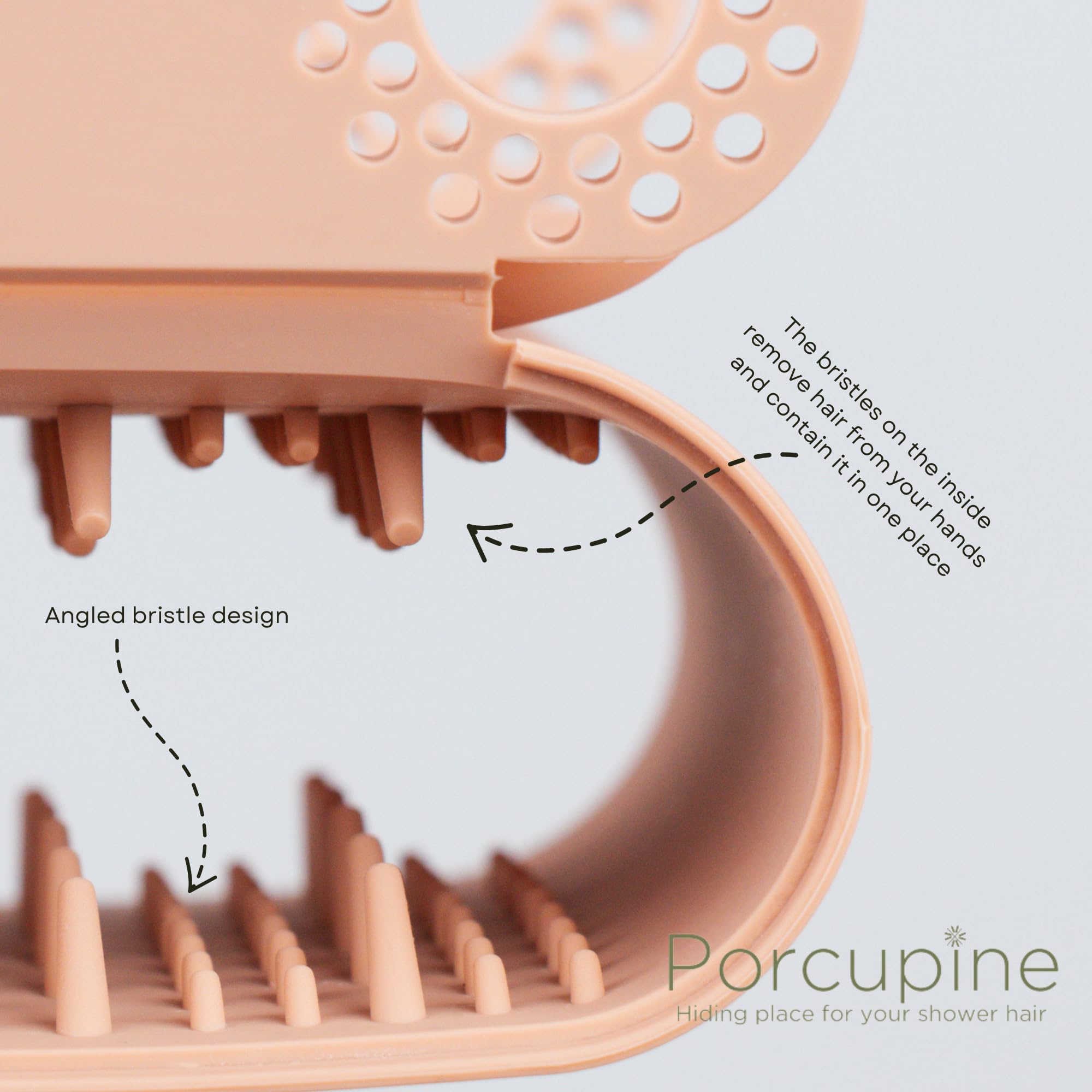 Porcupine shower wall hair catcher mounted in shower demonstrates durable silicone design.