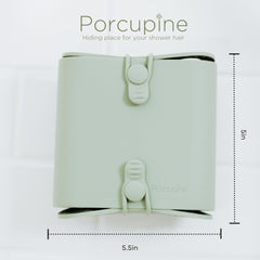 Porcupine shower wall hair catcher silicone bristles close-up shows easy cleaning.