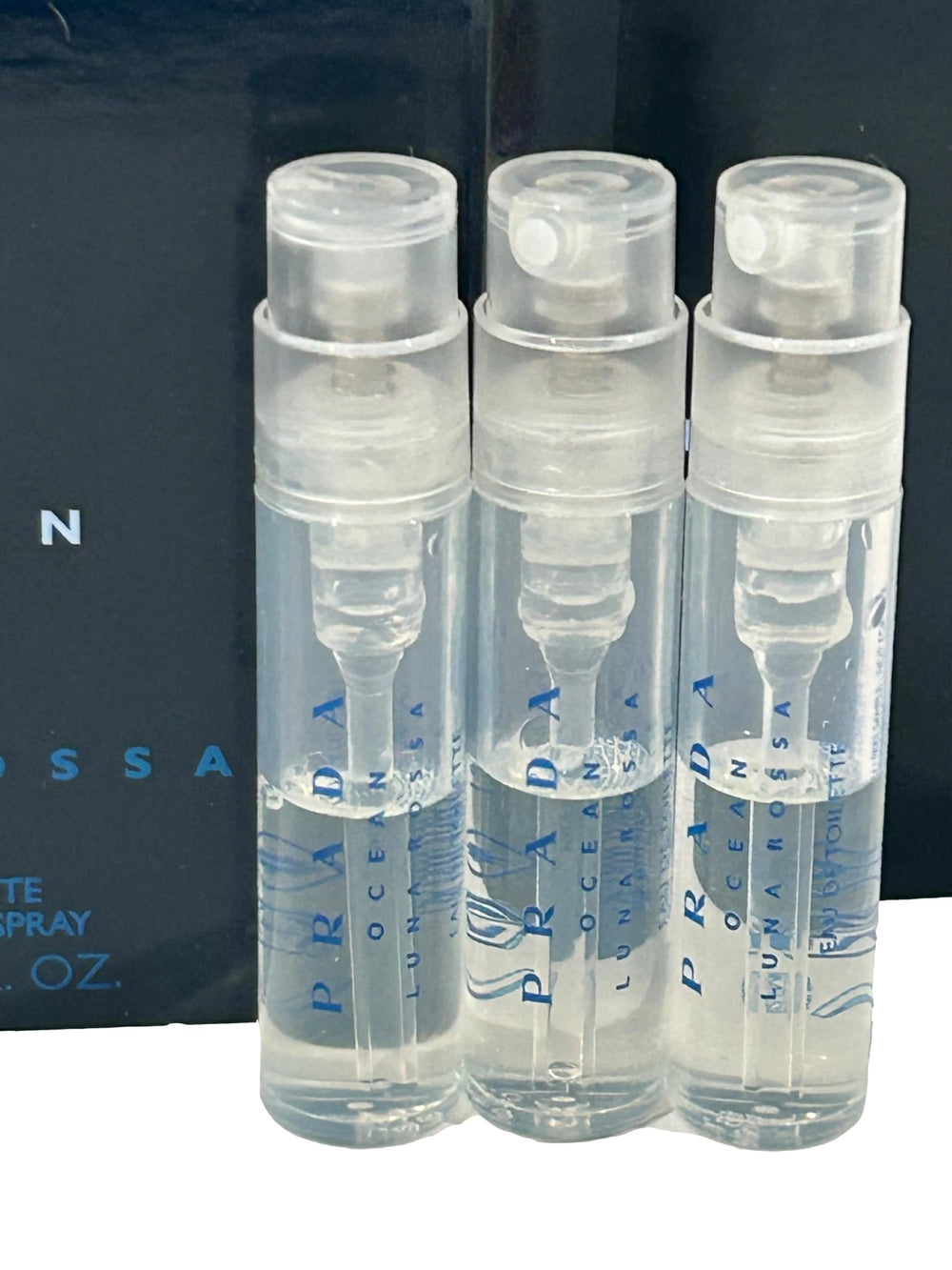 PRADA OCEAN Luna Rossa EDT sample bottle emphasizes iris-saffron heart for refined style testing.