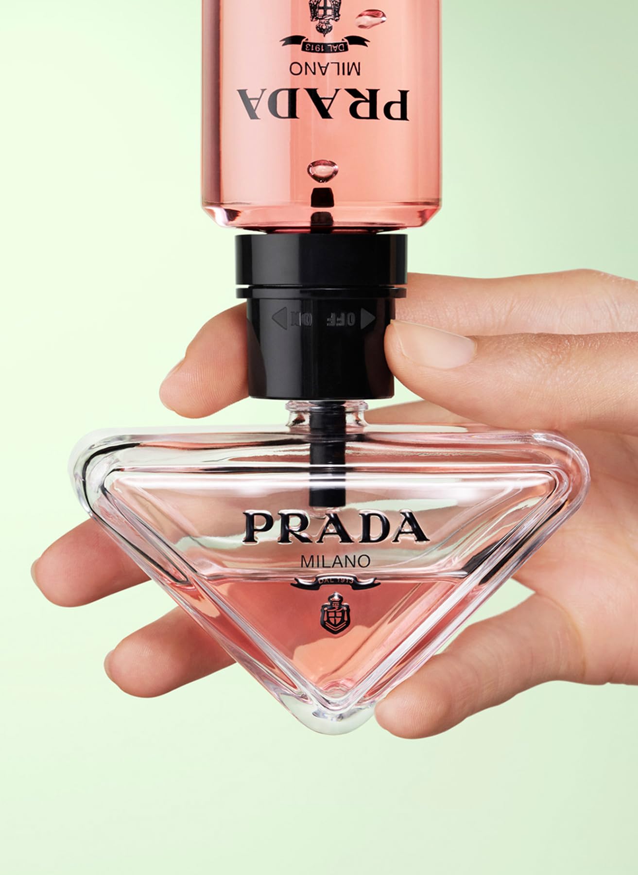 Prada Paradoxe bottle reflection, glamorous moment for evening events.