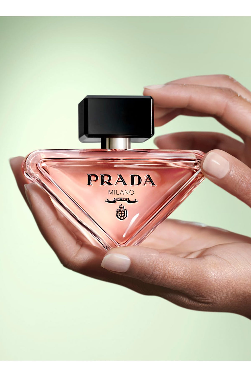 Prada Paradoxe fragrance diffusion image conveying long-lasting scent.