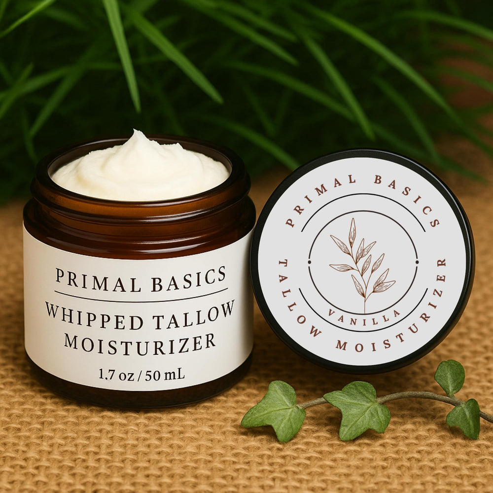 Primal Basics whipped-tallow-texture spreads on forearm for quick absorption.