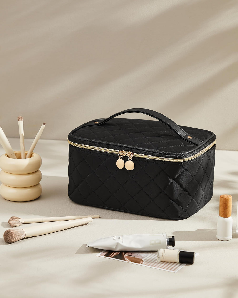 Prite makeup bag brush compartment keeps brushes protected and easy to grab.