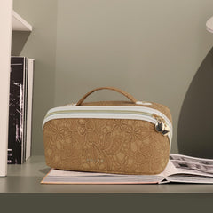 Prite cosmetic bag side pockets highlight quick access to brushes and essentials.