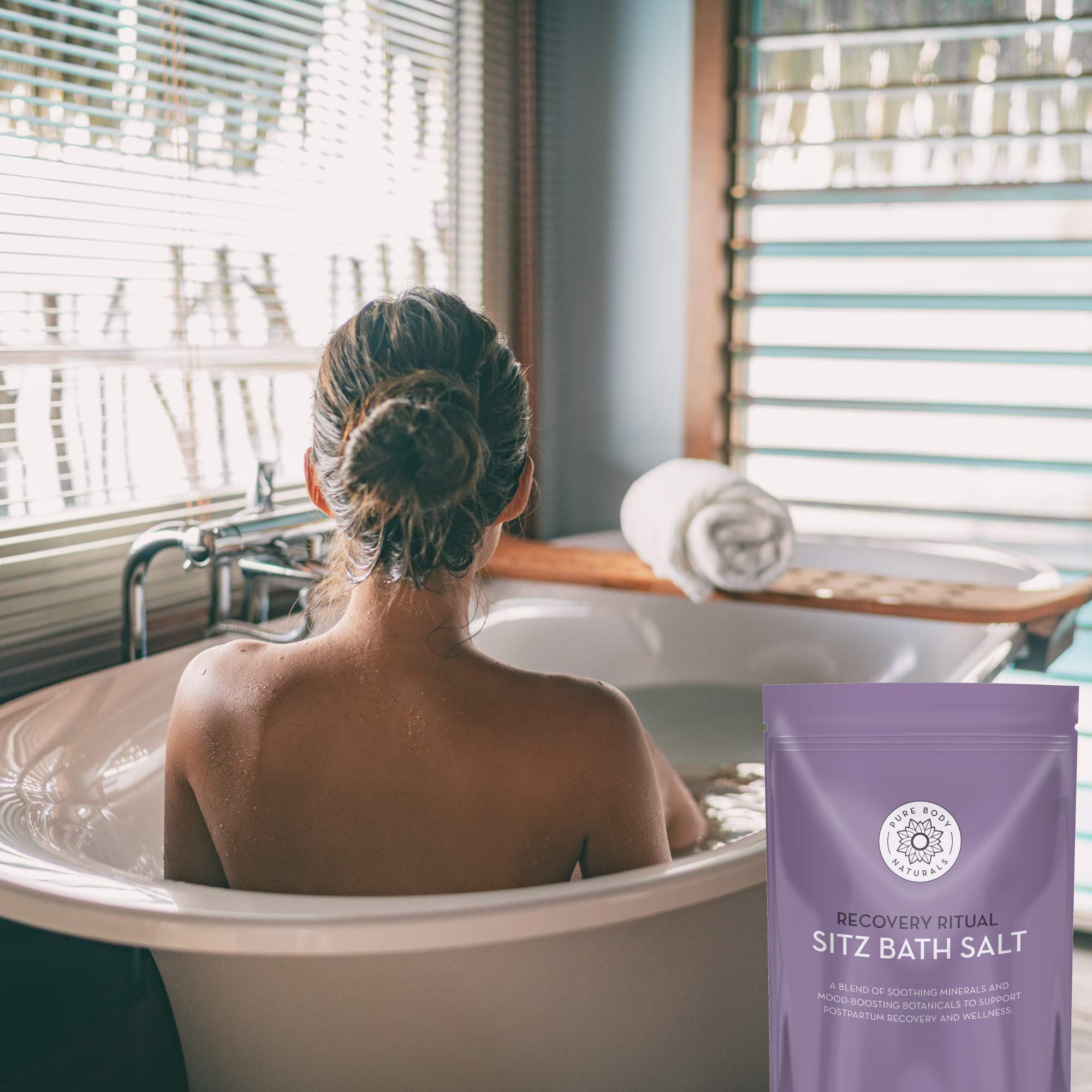 Pure Body Naturals sitz bath salt closeup highlights epsom salt and botanicals for calming relief.