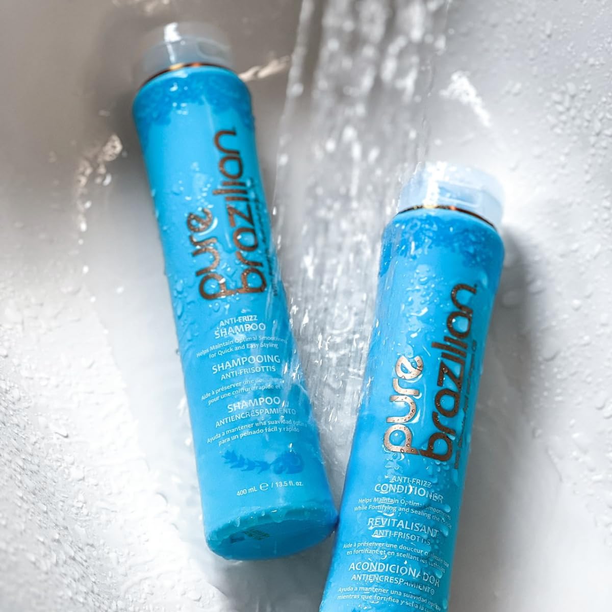 Pure Brazilian conditioner in use by stylist for smoothing