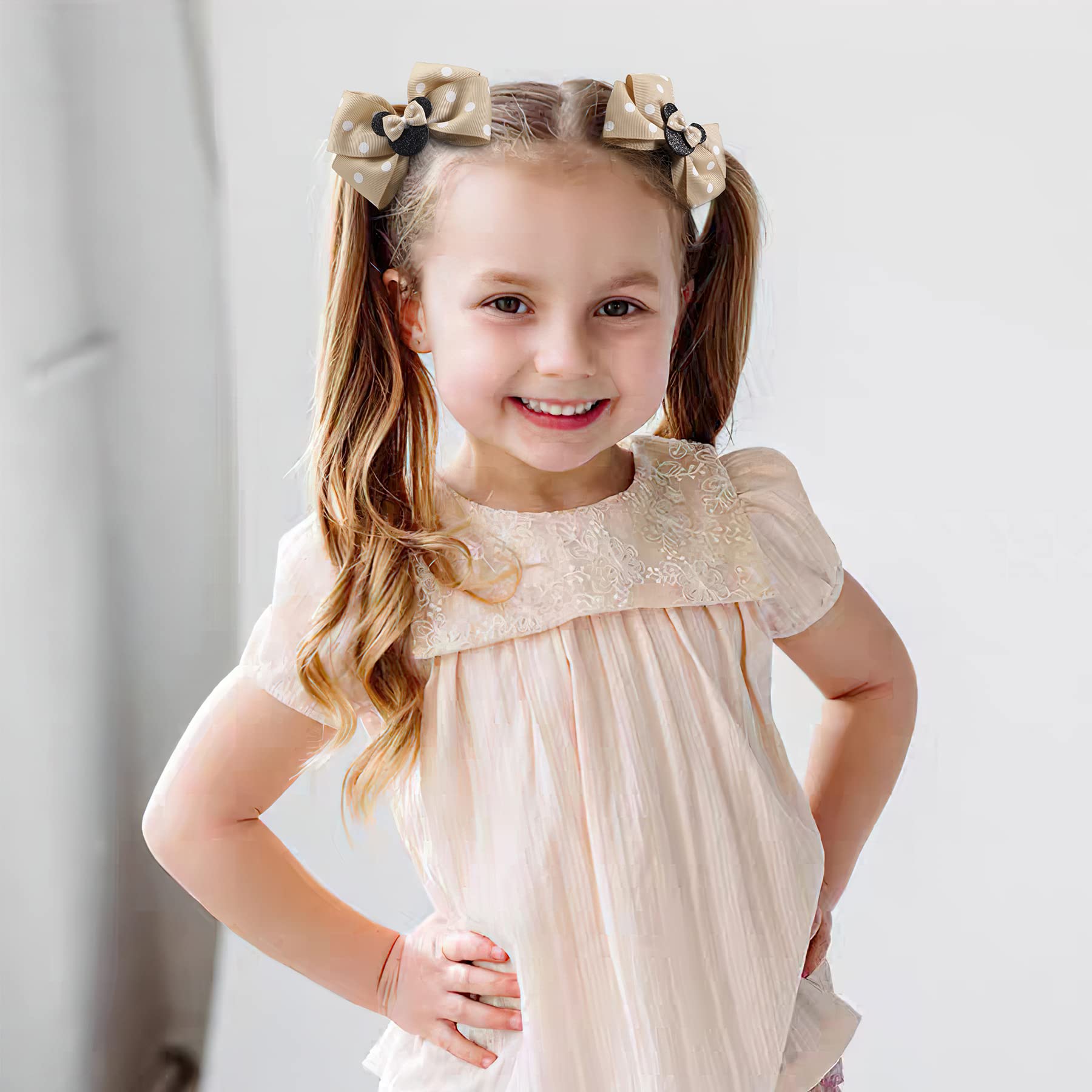 Qearl child wearing mouse ears bows during dress-up.