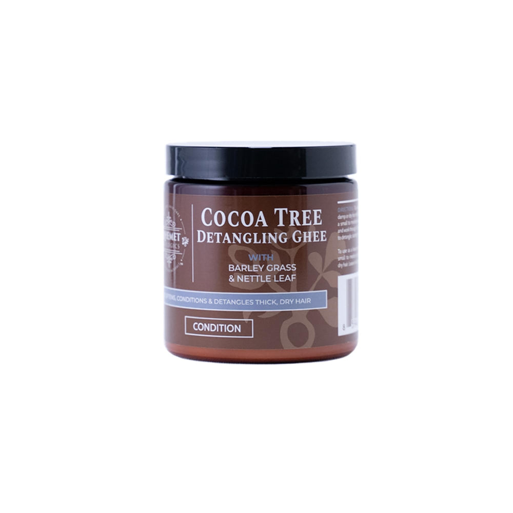 Qhemet Biologics Cocoa Tree Detangling Ghee bottle delivering rich softening moisture for high-porosity hair.