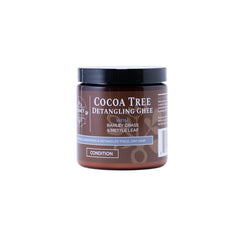 Qhemet Biologics Cocoa Tree Detangling Ghee bottle delivering rich softening moisture for high-porosity hair.