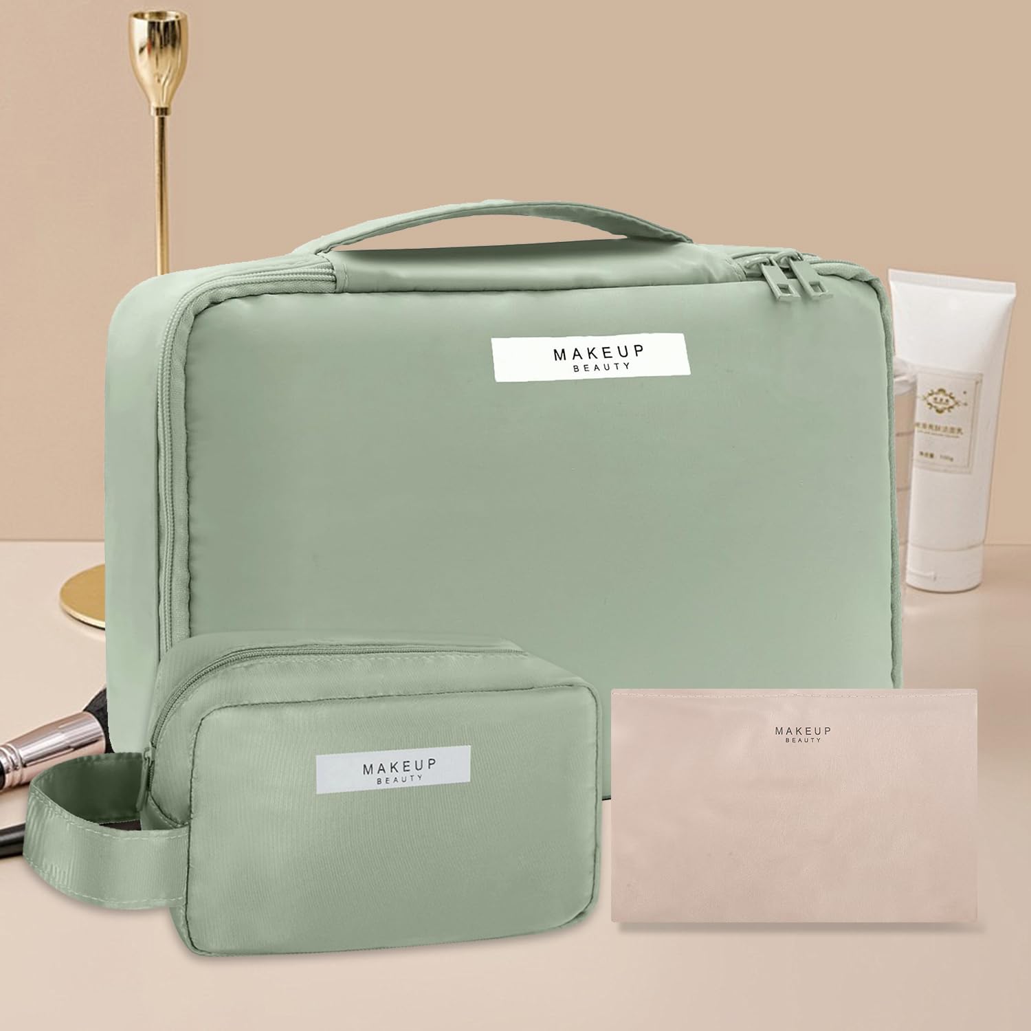 Queboom travel makeup bag green 3pcs flatlay demonstrates portable, compact design for travel.