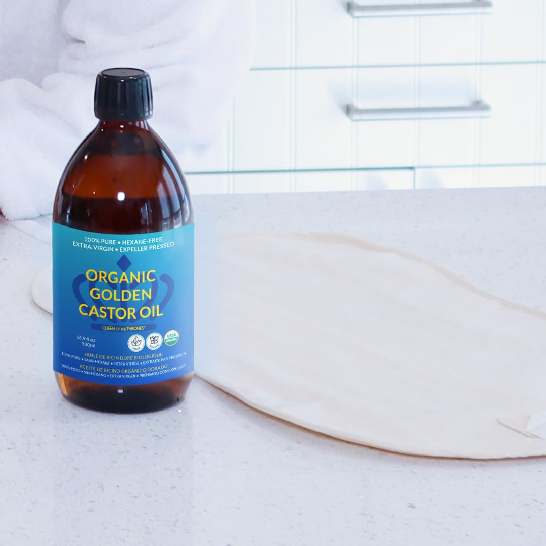 QUEEN OF THE THRONES practitioner-grade organic castor oil bottle for pure botanical care.