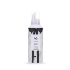 R+Co Chiffon Styling Mousse dispensing pump shows light foam for volume boost