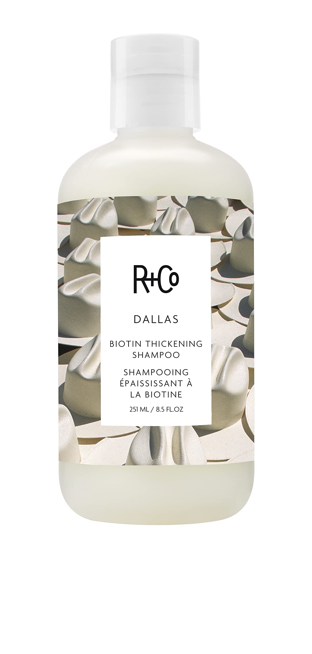 R+Co Dallas Thickening Shampoo bottle front showing volumizing biotin benefits for fine hair