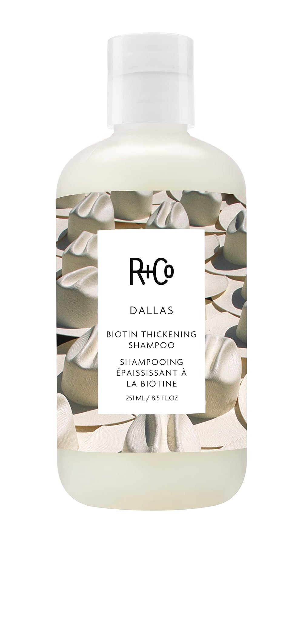 R+Co Dallas Thickening Shampoo bottle front showing volumizing biotin benefits for fine hair