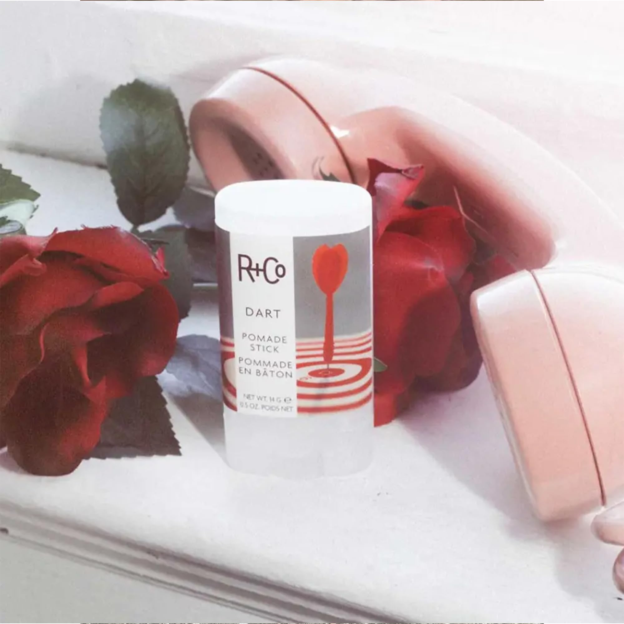 R+Co Dart Pomade Stick 2-pack display showcases value for frequent stylists.