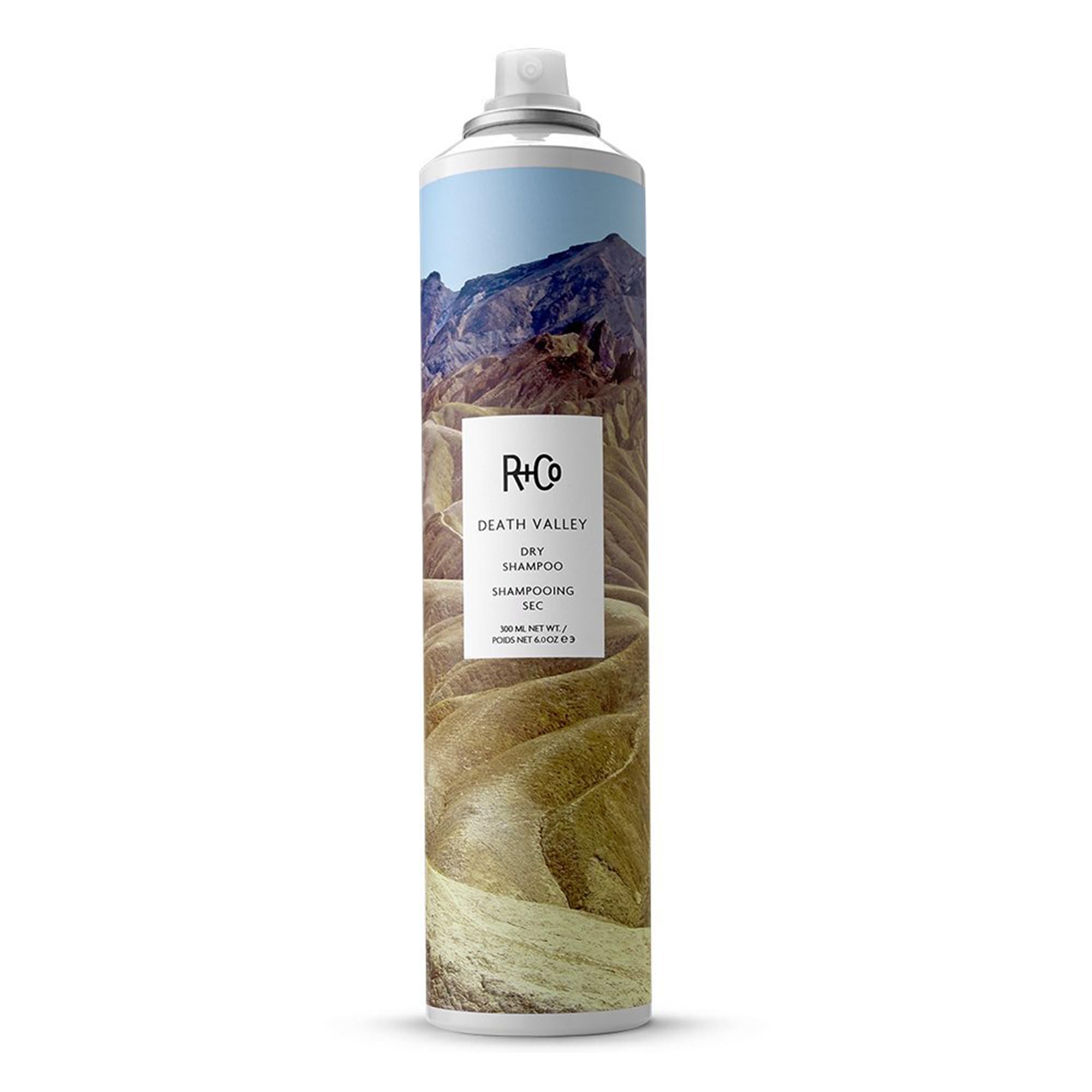 R+Co Death Valley dry shampoo bottle boosts volume for day-long lift.