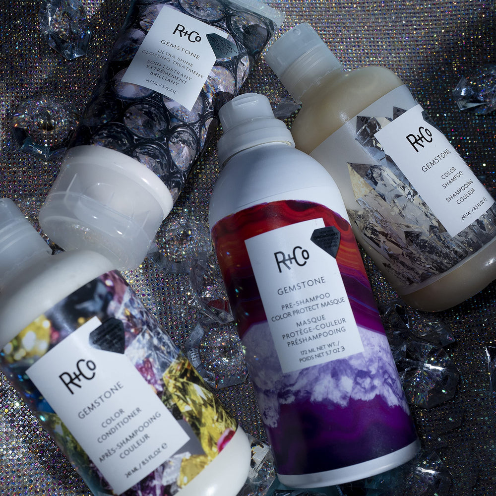 Damp hair with Gemstone Ultra Shine being applied evenly.