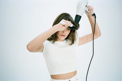 R+Co Mood Swing frizz-humidity image demonstrates resistance for lasting smoothness.