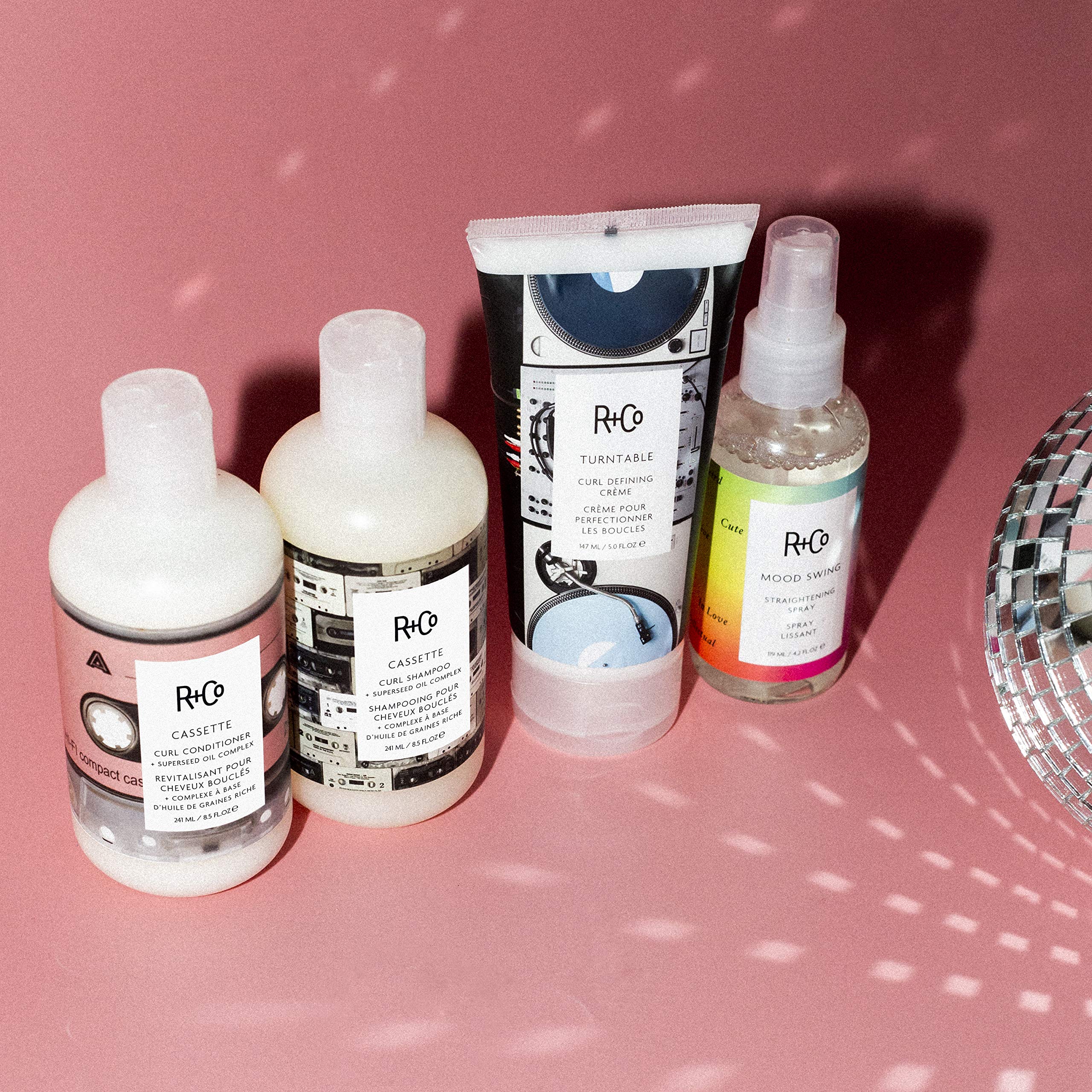 R+Co Mood Swing closeup highlights radiant shine after heat-activated straightening.