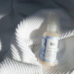 Close-up of texture on hair with R+Co On A Cloud Baobab Oil Repair Splash.