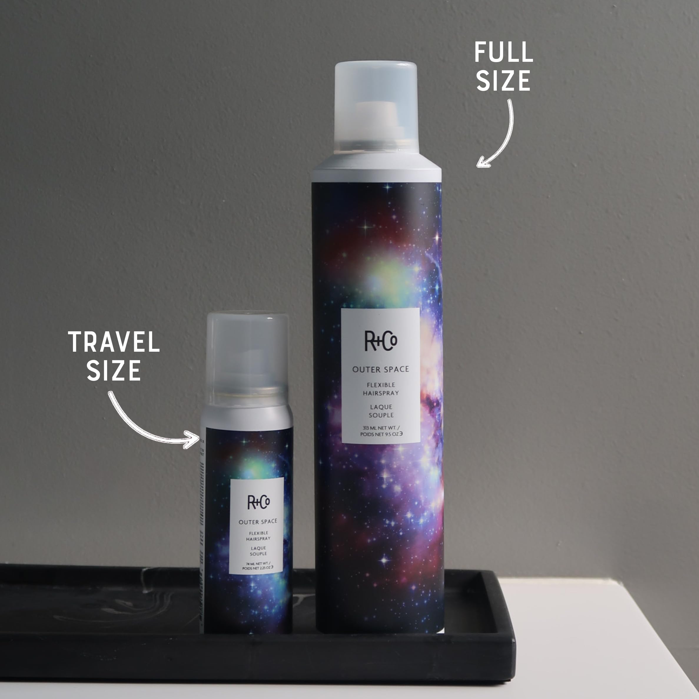 R+Co Outerspace Light Hair Spray hand-application shows quick on-the-go touch-ups