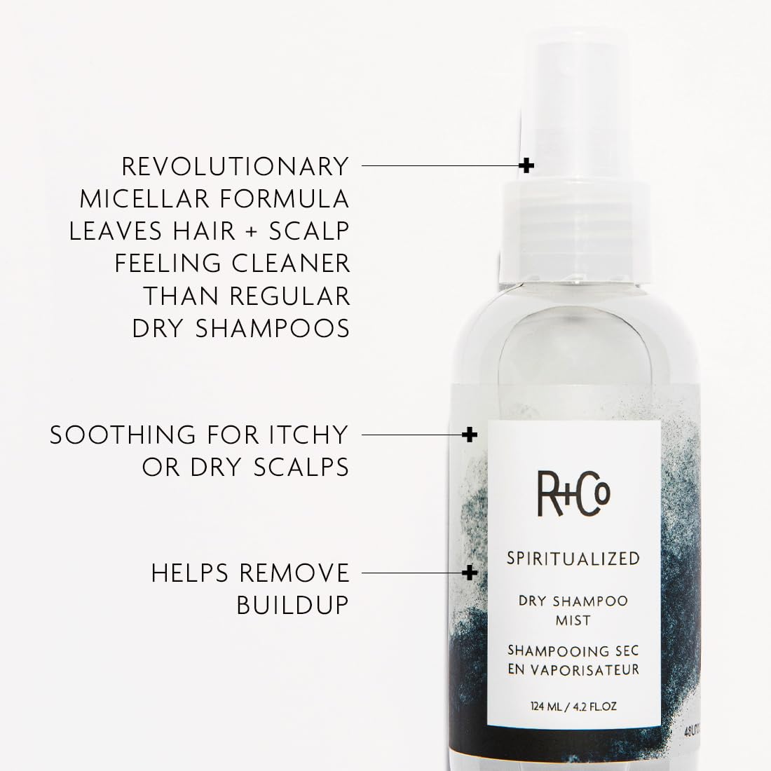 R+Co Spiritualized Dry Shampoo Mist pump dispensing near roots for instant lift.