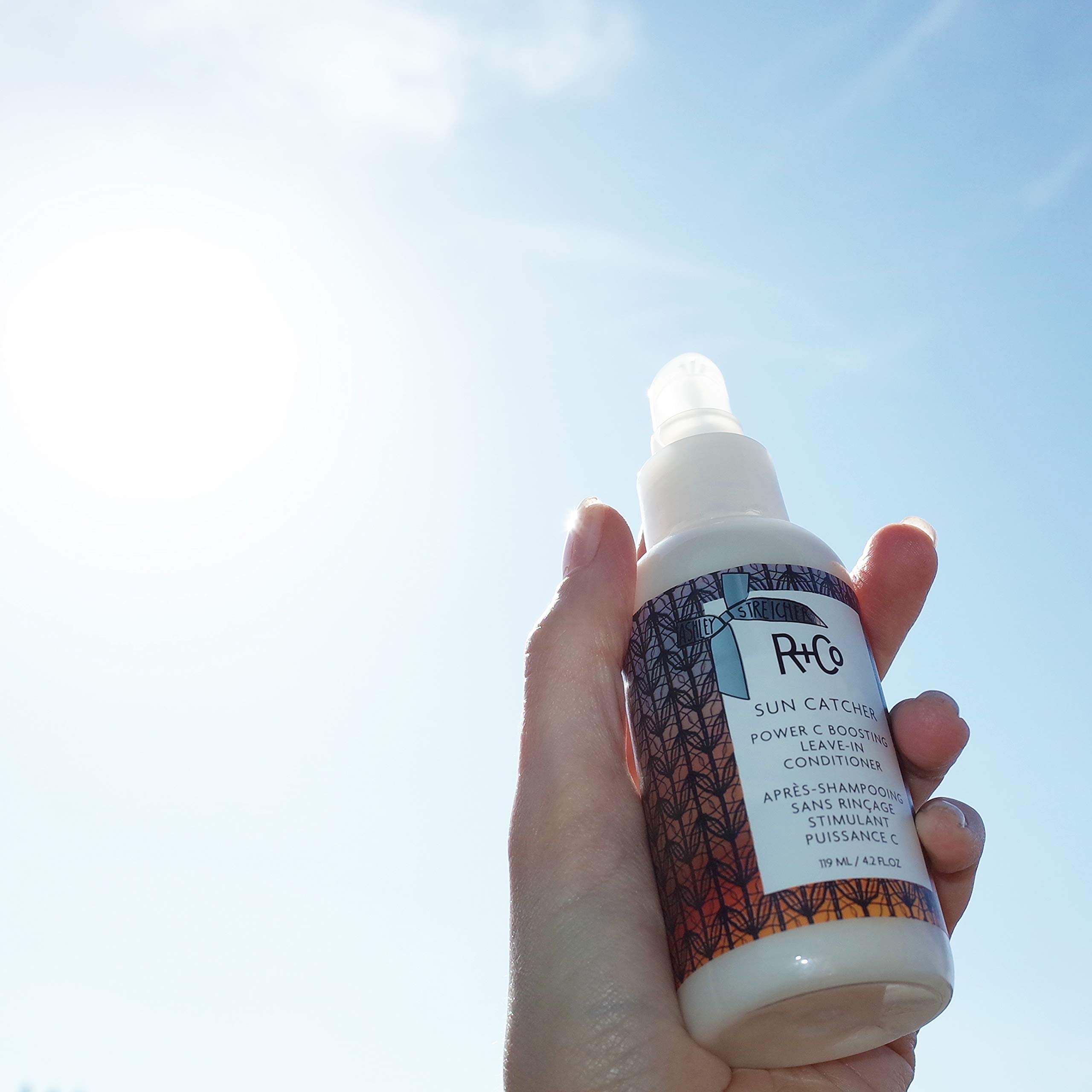 R+Co Sun Catcher Power C Leave-In collagen-rich formula fortifying hair fibers.