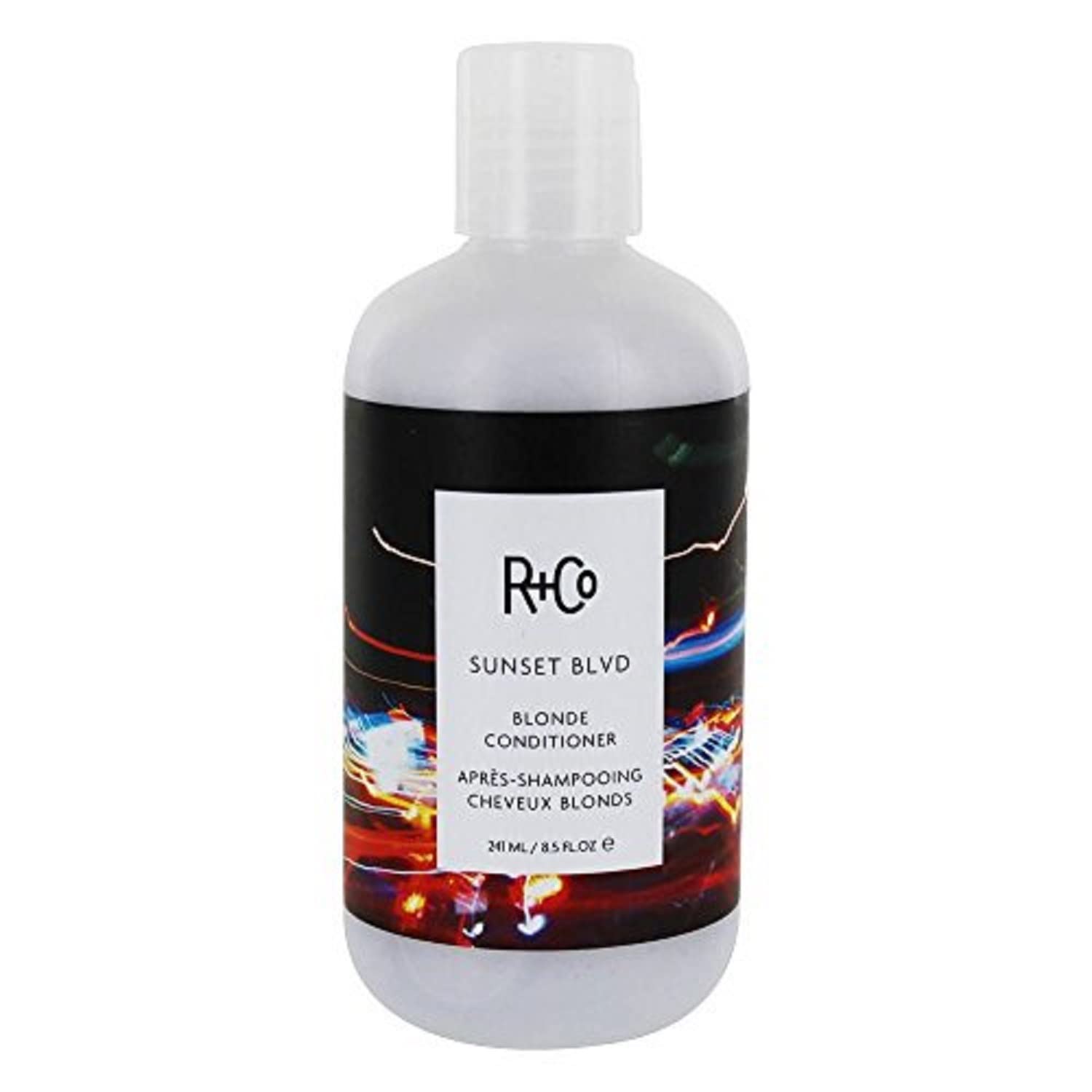 R+Co Sunset Blvd Blonde Conditioner bottle closeup showing brightening and hydration benefits