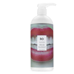 R+Co Television Perfect Hair Shampoo pump dispenses creamy lather, suggesting a luxurious cleanse.
