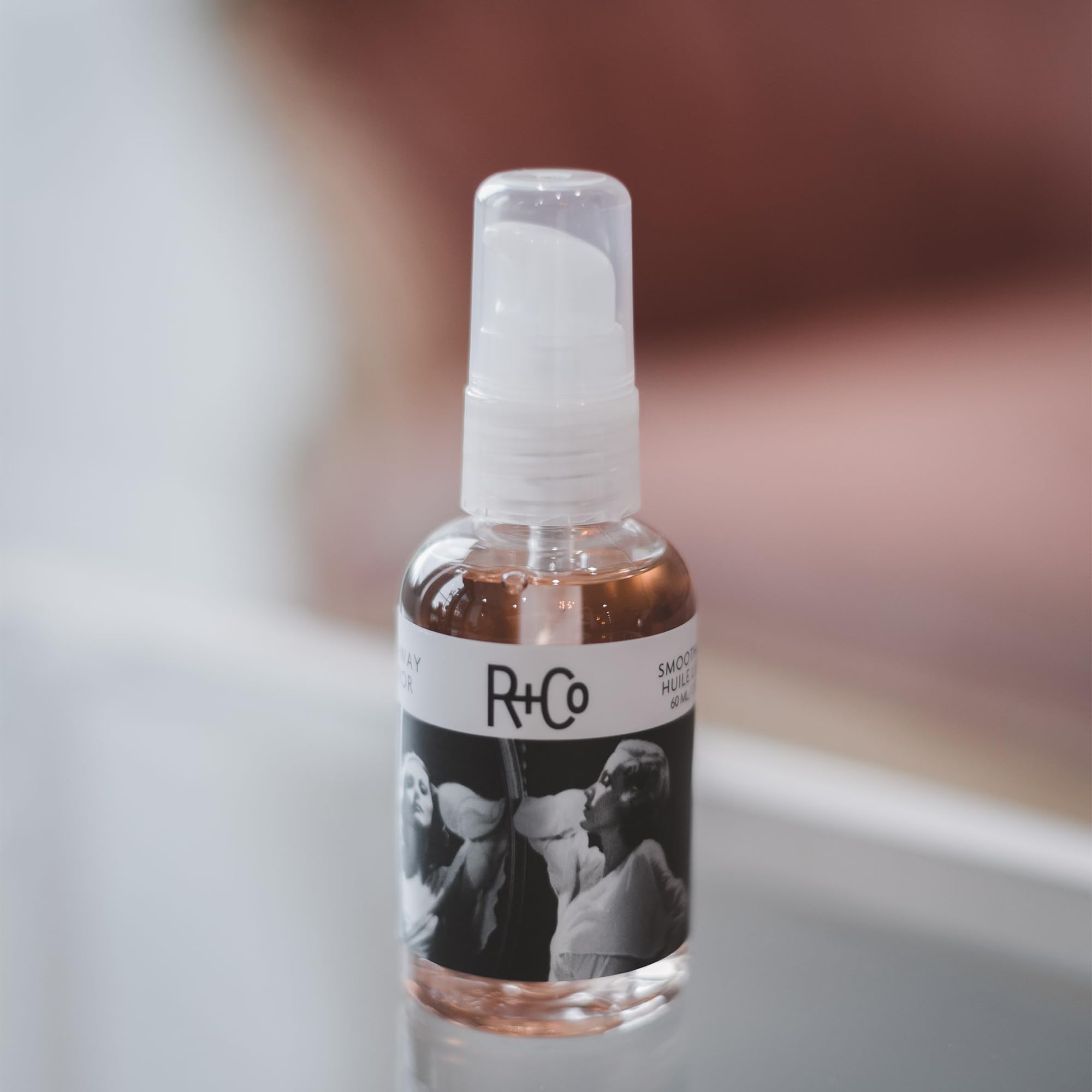 R+Co Two Way Mirror apply-hands demonstrates lightweight shine on mid-lengths.