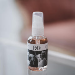 R+Co Two Way Mirror apply-hands demonstrates lightweight shine on mid-lengths.