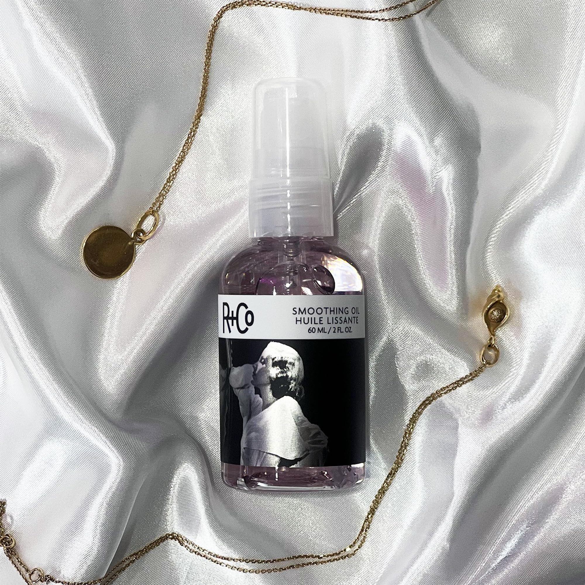 R+Co Two Way Mirror smoothing oil on hair close-up shows polished lustre.
