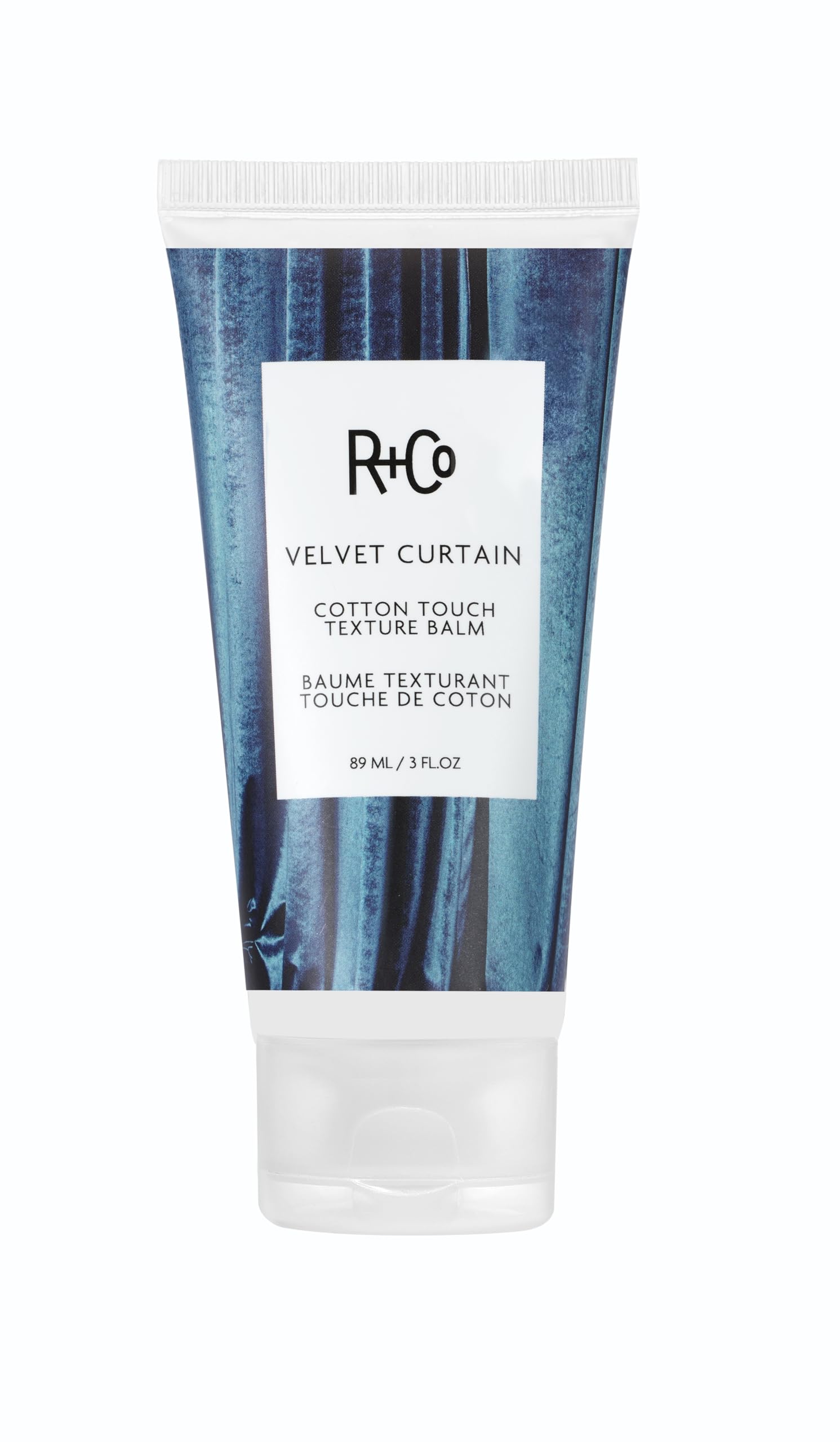 R+Co Velvet Curtain Balm bottle showing soft volume and light hold.